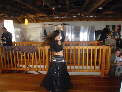 Photo of the belly dancers spinning with a sword