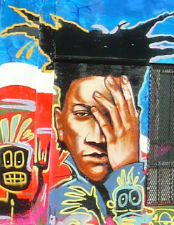 mural image of black man with hand on face