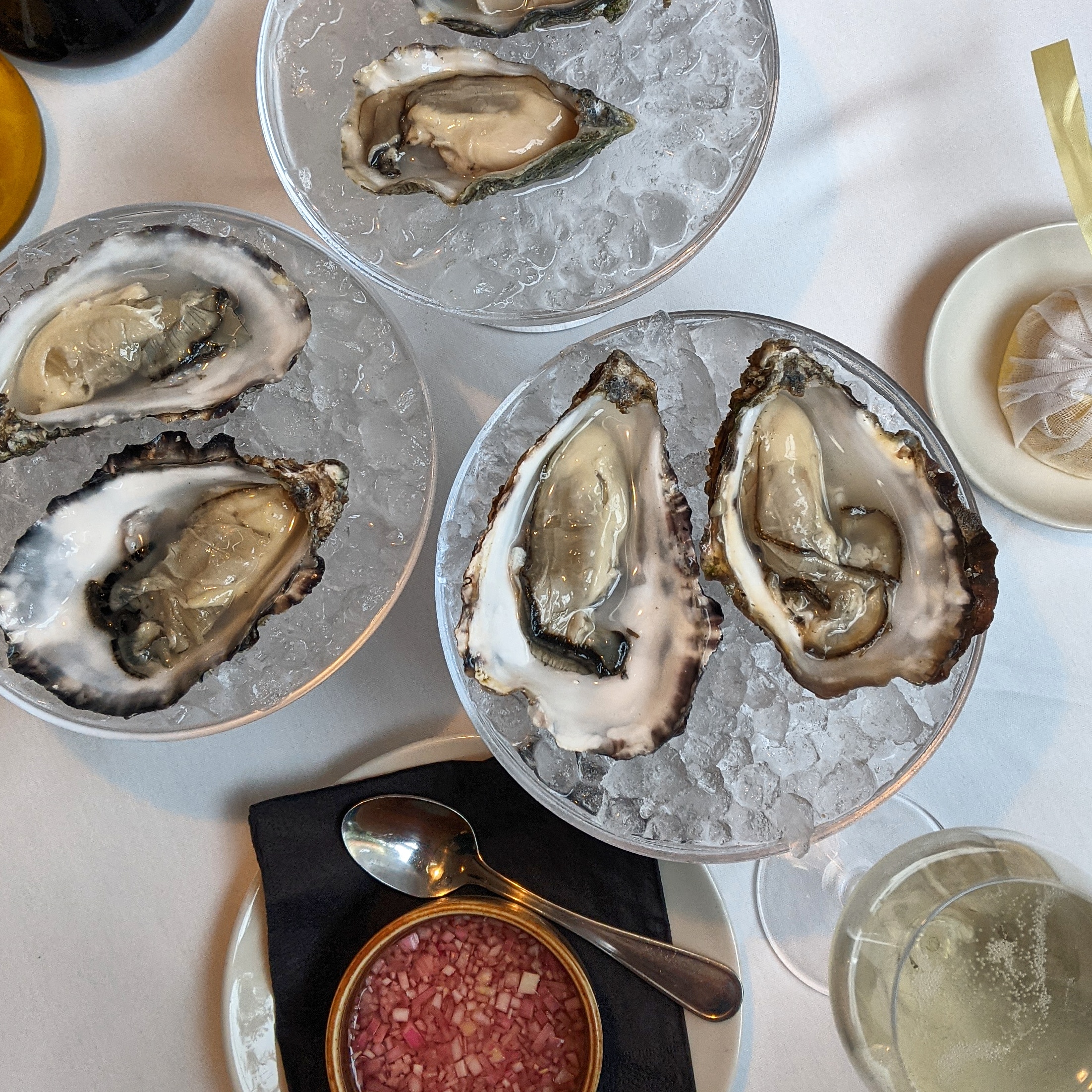 three plates of oysters on ice at the hari hotel in london