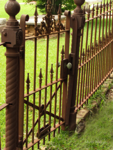 Wrought iron fence surrounding family cemetery plot