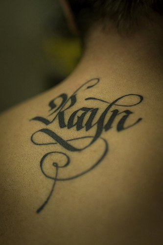 Calligraphy letter tattoo