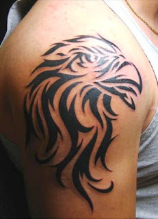 http://allaboutbodyart.blogspot.com - bald eagle_tribal_tattoo_design_on_arm