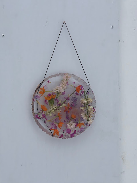 Ice Disk with Flowers Hanging by Front Door