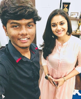 Keerthy Suresh with a Fan