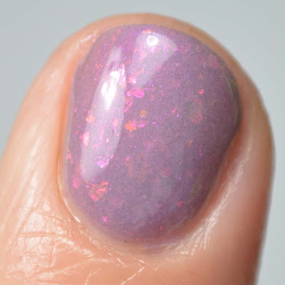 purple flakie nail polish close up swatch