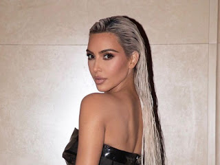 Kim Kardashian Wears Dark Tank Top and Leather Pants Out With Khloe In Miami Photos