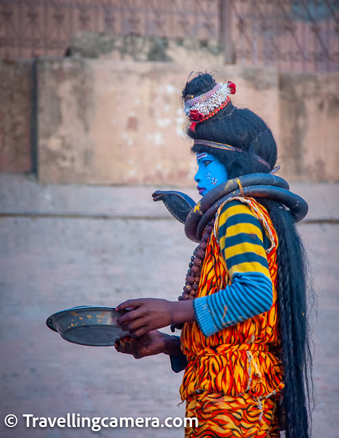 Bahrupiyas are a unique and fascinating feature of the cultural landscape of Varanasi, one of the oldest and holiest cities in India. These skilled impersonators can transform themselves into anyone, from famous movie stars and politicians to mythological characters and animals. They roam the ghats, the series of steps leading down to the banks of the Ganges river, and offer their services to the crowds of pilgrims and tourists that visit the city. Many of them have inherited the profession from their ancestors, and they take great pride in their artistry and ability to captivate audiences. They use makeup, wigs, costumes, and props to create their illusions, and their performances range from comedic to serious and thought-provoking. Despite the challenges they face in a rapidly changing world, the bahrupiyas of Varanasi continue to enchant and amaze visitors with their skill and creativity.