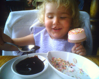 Top Ender eating a dipping icecream pudding and putting her spoon in the chocolate sauce