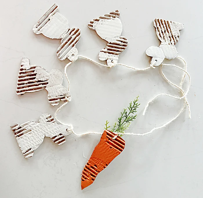 bunny banner with a carrot on twine