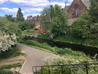 The Union Canal with a church behind it.