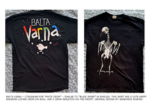 black tshirt with "Balta Varna" on back, painted in rainbow colors, above a cute white cartoon crow.  Front of shirt has an authentic representation of a dancing crow skeleton.