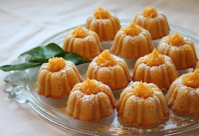 Food Lust People Love: Citrus Lust Mini Bundt Cakes are topped with homemade lemon curd for a gorgeous and deliciously sweet and tart dessert that will delight fancy guests and family alike.