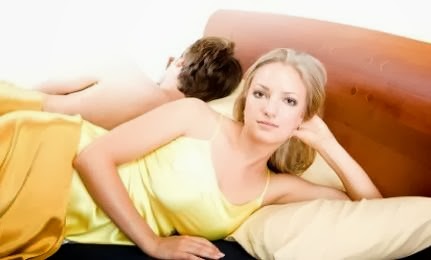 Rethinking the 5 Top Libido Killers  - man woman wearing yellow dress bed sleeping
