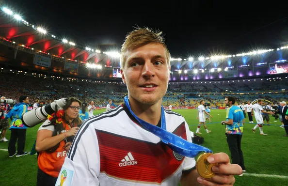 Toni Kroos of Germany celebrates with his medal after defeating Argentina 1-0 in extra time during the 2014 FIFA World Cup Brazil Final match between Germany and Argentina at Maracana on July 13, 2014 in Rio de Janeiro, Brazil