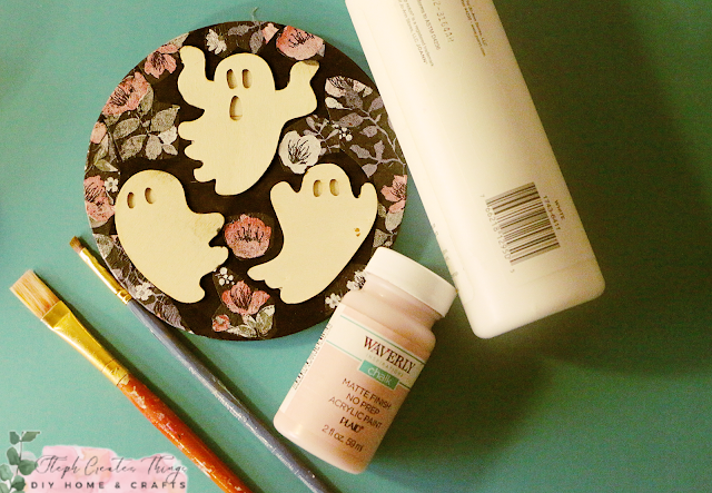 Halloween decor, paintbrush, and acrylic paint