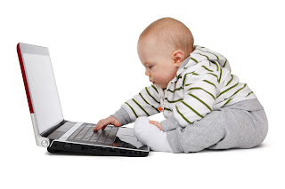 Picture of baby working on laptop from PublicDomainPictures.net