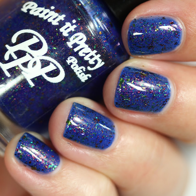 ocean blue nail polish with shimmer and tiny holographic flakes