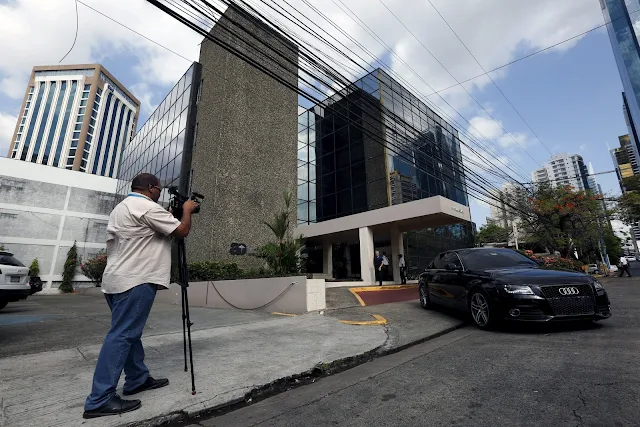 A cameraman is seen outside the Arango Orillac Building where the Mossack Fonseca law firm is situated at, in Panama City, April 4, 2016. REUTERS/Carlos Jasso