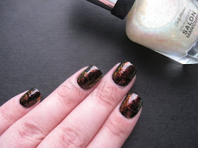 Sally Hansen Hidden Treasure over black sally hansen hidden treasure flakie polish nailswatches