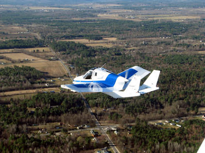 This March 23, 2012 photo provided by Terrafugia Inc. shows the company's prototype flying car, dubbed the Transition, during its first flight. The vehicle has two seats, four wheels and wings that fold up so it can be driven like a car, and flew at 1,400 feet for eight minutes during the test. Commercial jets fly at 35,000 feet