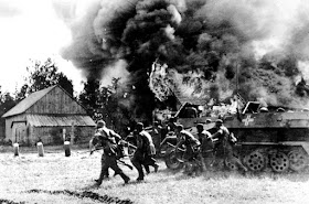 German troops assault a burning Soviet village 26 June 1941 worldwartwo.filminspector.com
