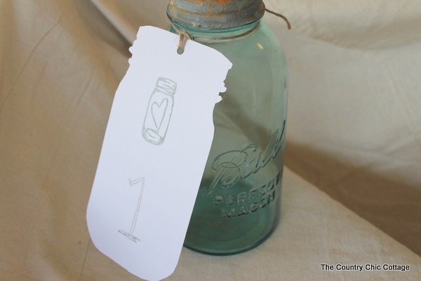 I just used my Silhouette to cut them out mason jar tags for wedding