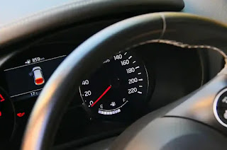 why does my car rpm go up and down while parked