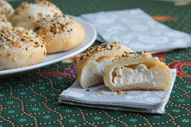 Food Lust People Love: These stuffed bagel balls are baked till golden with lovely cream cheese inside, topped with everything bagel seasonings. From the fundraising cookbook, Family Meal in aid of the Restaurant Workers' Community Foundation.