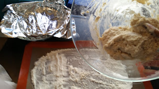 Scrape dough onto flour surface