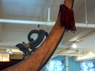 dog decoration on stern (?) of Solomon Island canoe at Peabody Museum