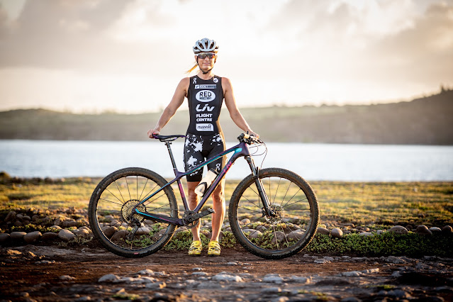 Triathlete and Xterra competitor Jacqui Slack with everything she needs: something to swim in, something to ride and something to run on.