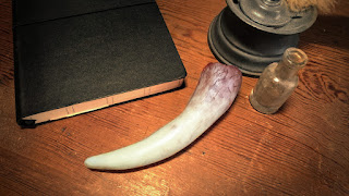 The completed cast and painted basilisk tooth
