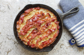 Food Lust People Love: This baba kartoflana or Polish potato pie is a super rich comfort dish baked with grated potatoes, eggs and bacon. It makes a great main course or side dish.