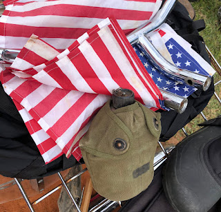 U.S. flags and army canteen for sale.