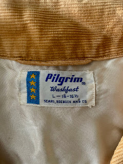 A close up of a vintage pilgrim label