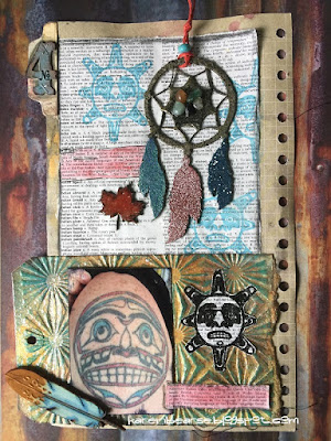 A colorful art journal with photo of Haida Sun tattoo, stamps of the image and a chipboard painted dreamcatcher. 