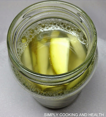 Mango slices in a bottle before adding spices