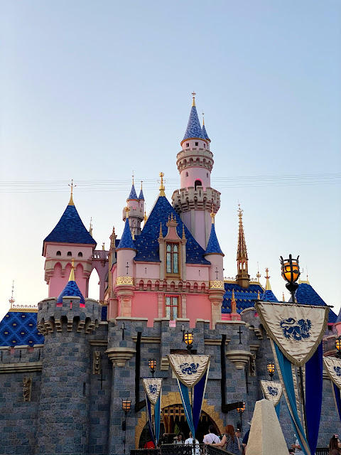 A view of Sleeping Beauty Castle at Disneyland at night.