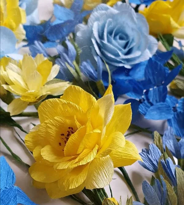 yellow and blue crepe paper flowers