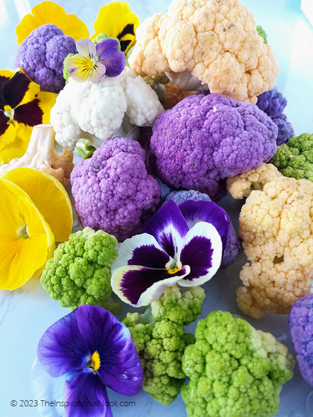 Rainbow cauliflower and purple and yellow pansies, , Fall, Halloween, purple cauliflower, orange caulifower, light green cauliflower, broccoflower