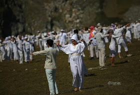 Followers of the Universal White Brotherhood, an esoteric society that combines Christianity and Indian mysticism set up by Bulgarian Peter Deunov in the 1920s, perform a dance-like ritual called "paneurhythmy" in Rila Mountain, Bulgaria, August 19, 2017. REUTERS/Stoyan Nenov (Reuters)