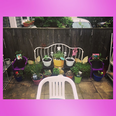 patio fairy garden with upcycled furniture container garden of herbs, flowers and succulents