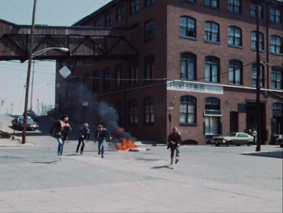 gang sets mattress on fire in the middle of the street