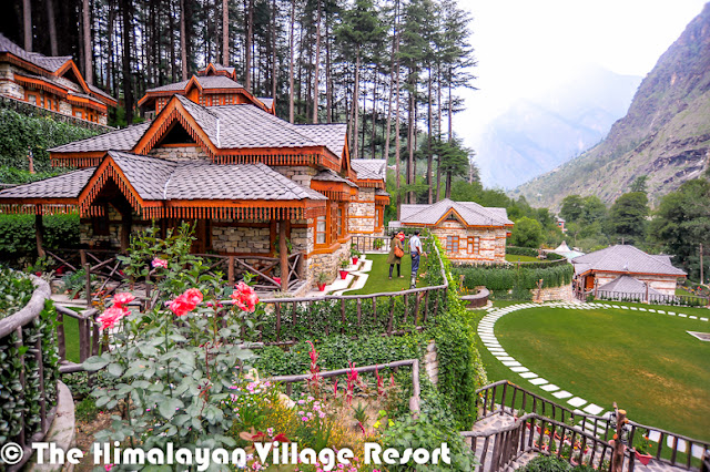 Want to enjoy Chamba, Kinnaur, Mandi, Kangra, Shimla, Spiti, Lahaul and Kullu at the same time? No I am not kidding! You could actually do that at the Himalayan Village Resort.And these are names of the cottages in the quaint resort, and captured the flavors of Himachal – the interiors, the food, entertainment-under one roof The resort, set amidst thick Deodar forest, helps you rediscover yourself, The serene mountain landscape of the land of gods and the unique architecture of Himalayan village resort- made of stone and wood-is so captivating that you many not want to go back to the city and its choresThe resort has been built in the ancient Kathkunia style –dry stacking stones and wood without cement. The inner walls are mud plastered to retain the native rustic charm. The resort is Eco-friendly and gives you an insight in the local customs and traditions. There are 8 cottages including two Machan- style rooms.The decor theme of each of the 750 sq ft cottage is built around the different culture flavors of Himachal Pradesh the decor of each room has been done up thematically, reflecting the tradition and culture of the state –deodar wood work, beautifully carved teak furniture, handmade Tussar silk curtains and traditional brass fittings give each room a cozy feel as you have come home. The resort provide daily housekeeping and evening turn down services.All cottages are equipped with a king size bed,4-seater sofa, study, mini Fridge ,mini bar, separate dressing area, fully furnished and equipped toilets and personal lawn. They also have private sit-outs. Lahaul and Kullu the Machan –Style cottages are the USP of the resort. They offer a sweeping view of the mountain landscape. Book the machans well in advance as they are most sought-after cottage because of their unique setting. The resort has mult-cusine restaurants, a well done up cozy bar that stocks finest liquor from around the world and a fully equipped spa to pamper you. The spa offers heat sauna, steam sauna, Jacuzzi aroma bath therapy, acupressure and massages and kero therapy.In case you planning a business gathering, the resort can accommodate different group size .It has world class facilities for organizing meetings. At the resort, you could be torn between staying indoors and going outdoors. If you are the outdoor types, the hotel can arrange many activities such as river crossing, rappelling, nature walks jungle excursions, rock climbing, mountain biking, trout angling, trekking and river rafting, horse riding, jeep safaris jungle barbecue.In case you feel like lazing around, simply sit in the private garden of your suite and let the sun-rays filtering through the Deodar tree play on you.A holiday at the resort and the cool greenness of Kullu with its wide range of trees, ferns and native flora will act like balm for your dust-weary soul. That‘s a promise!Just look at the right-bottom corner of above photograph, which shows the location on a hill where 'The Himalayan Village Resort'  is located.The Himalayan Village is one of the premier holiday resorts in Himachal Pradesh offering exciting Himachal tour packages.The Himalayan Village is a glorious mix of style, top class facilities, where the traditional architecture & aesthetics blend harmoniously. 'The Himalayan village' is an ideal place to rejuvenate amongst nature and its ways. Sitting under deodar jungle in the morning hours with the sunrays breaking through brings with it the peace of nature. 'The Himalayan Village' situated at the foothills of the famous malana village, the oldest democracy in the world & just 10 K.M short of manikaran, famous for its hot water springs, right on the bank of ice cold parvati river. A highly revered pilgrimage being the tapobhoomi of Bhole Nath for 11000 years & later visited by the great Sikh guru Sh. Gurunanak dev ji. The valley has some real good treks, majestic flower valleys, thick flora and fauna, crystal clear waterfalls, rivers in virtuous serine parvati valley the 'tapobhoomi' of shiv shamboo. The village has thick deodar (pine) forest as the crown, river parvati wetting its feet, mountains made of black hard-rock, wih as many features as one’s mind can think of protruding as lingas in different shapes & sizes. Snow covered peaks making a perfect backdrop for this 'Shiv Nagari'. The village is a perfect place for nature lovers. The sights of day break, sunrise, and crystal clear skies full of numerous stars can remain etched in one’s memory forever.Made in pure traditional & ancient Kathkunia style (dry stacking of stone & wood without cement), with mud plastered walls from inside blending perfectly with deodar wood work, beautifully carved teak furniture, handmade tussle silk curtains, traditional brass fittings make a perfect blend of aesthetics and class. The cottages based on different districts of Himachal have a build in area of 600- 750 sq ft with mini bar, mini fridges, study, separate dressing, fully furnished and equipped toilets and personal lawns.The Himalayan Village has multiple restaurants, a beautiful traditional bar, a spa with heat sauna, steam sauna, Jacuzzi, aroma bath therapy, kero therapy, acupressure, and massaging to take care of you after a day of activities like river crossing, rappelling, nature walks, jungle incursions, rock climbing, mountain biking, trout angling, trekking, orchard picnics, rafting. After refreshing your mind and soul, join us for the traditional folk dances of himachal done by 'we the staff' and polish off the day with the mouth watering cuisines of himachal. 'The Himalayan village' is real insight to the lifestyle, culture, cuisines, architecture of We 'Pahari people' We promise you all a true Pahari warmth and love.