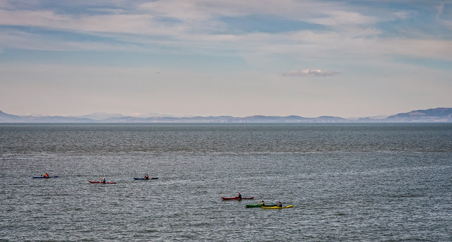 Photo of colourful canoes in the Solway Firth