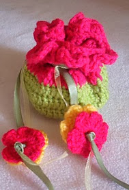 http://www.ravelry.com/patterns/library/mini-flower-gift-pouch