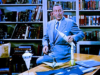 Walt Disney at his desk