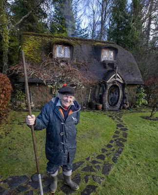 Grandfather outside his hobbit home