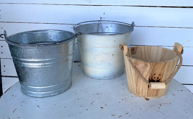 Photo of two galvanized and one wooden bucket from the thrift shop.
