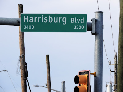 3400 Block of Harrisburg Blvd - Green Overhead Street Name Sign